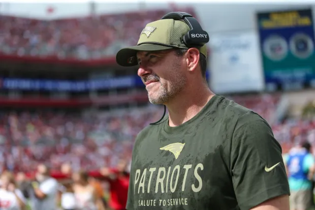New England Patriots outside linebackers coach Mike Smith walks the sideline before an NFL game against the Tampa Bay Buccaneers, Sunday, Nov. 9, 2025, in Tampa, Fla. The Patriots defeated the Buccaneers 28-23. (AP Photo/Gary McCullough)