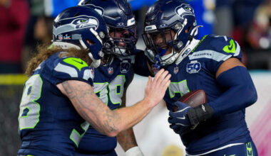 Seattle Seahawks linebacker Uchenna Nwosu, right, is congratulated by teammates after recovering a fumble and returning it for a touchdown during the second half of the NFL Super Bowl 60 football game against the New England Patriots, Sunday, Feb. 8, 2026, in Santa Clara, Calif. (Brynn Anderson/AP)