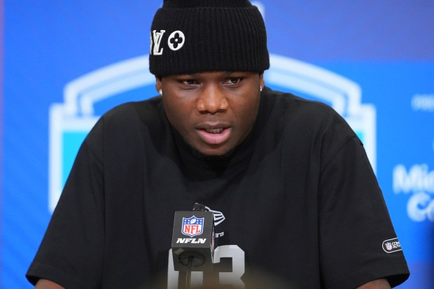 Louisville wide receiver Chris Bell speaks during a news conference at the NFL Combine in Indianapolis on Friday, Feb. 27, 2026. (AP Photo/Julio Cortez)