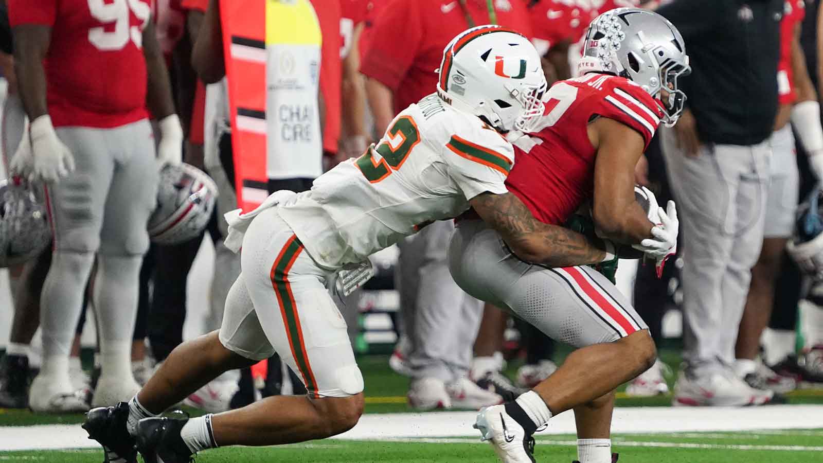 Miami's Jakobe Thomas (8) and Bryce Fitzgerald (13) get the crowd hyped during the College Football Playoff National Championship college football game at Hard Rock Stadium in Miami Gardens on Monday, Jan. 19, 2026.