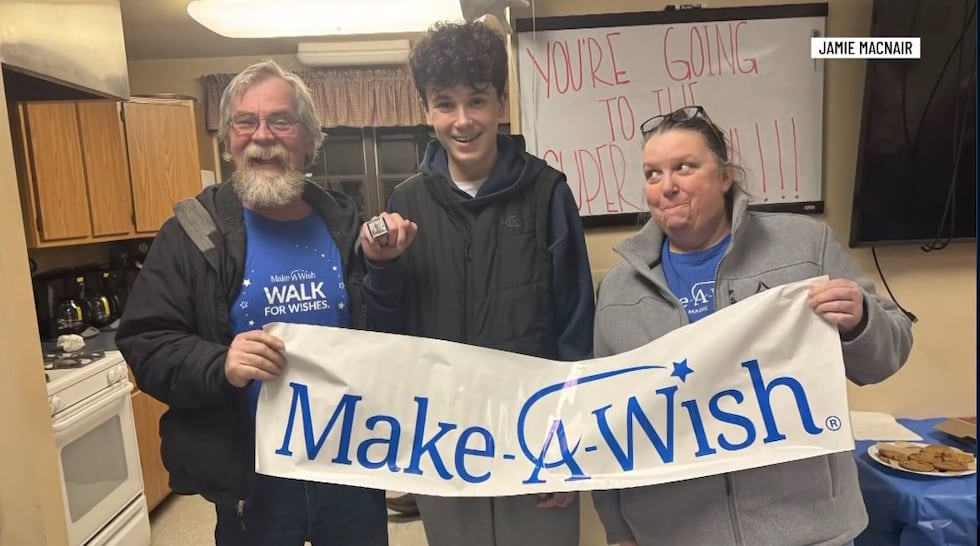 Avery MacNair, 15, (center) has been a New England Patriots fan for as long as he can...
