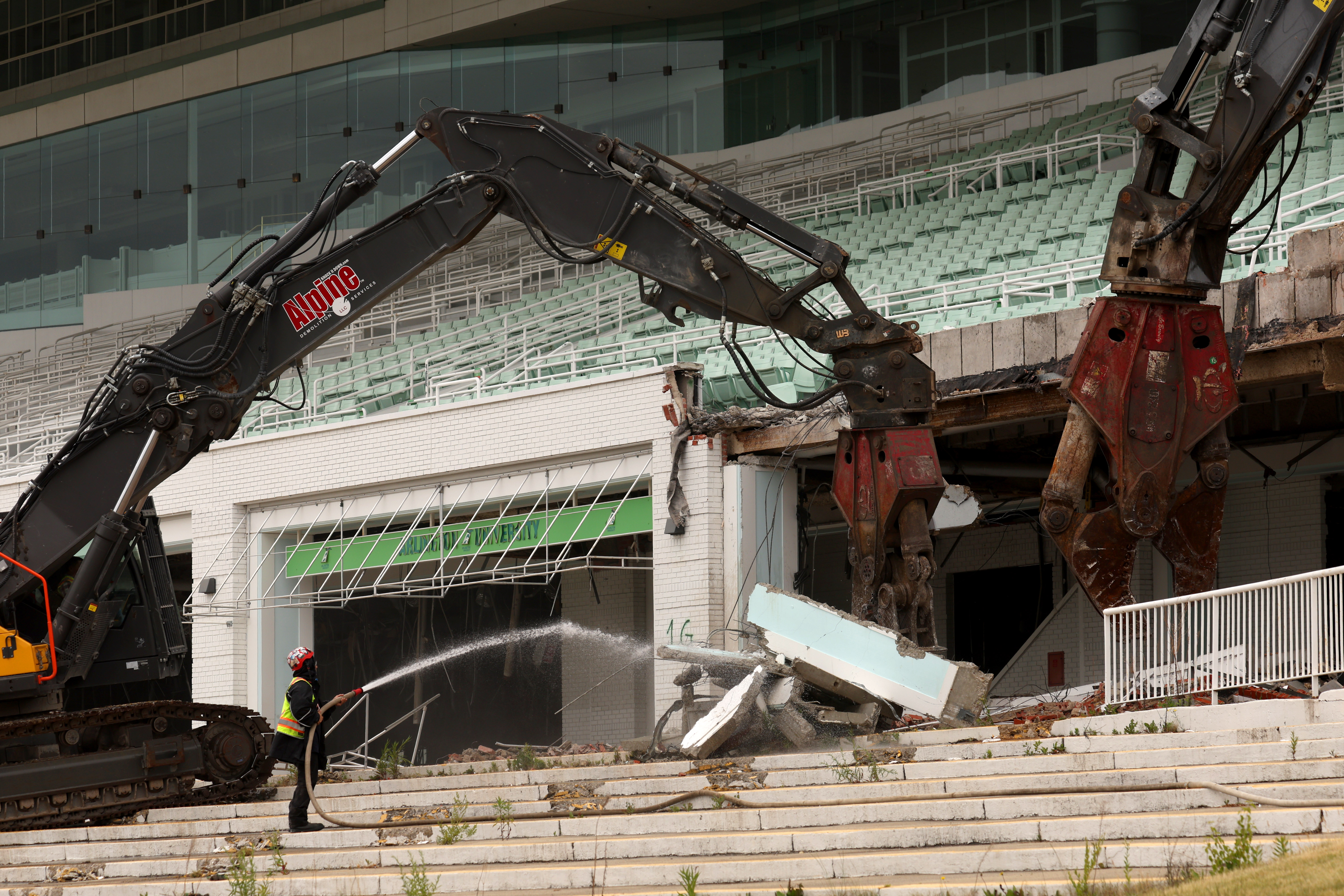 Demolition crews hired by the Chicago Bears begin knocking down...
