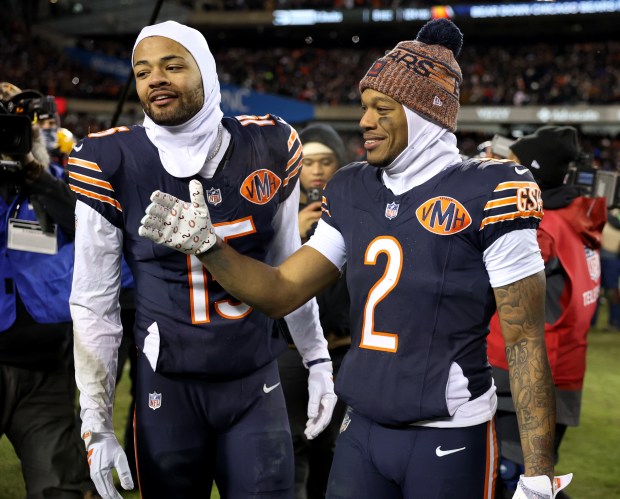 Chicago Bears wide receivers Rome Odunze and DJ Moore celebrate after their victory over the Green Bay Packers in an NFC wild-card game at Soldier Field in Chicago on Jan. 10, 2026. (Chris Sweda/Chicago Tribune)