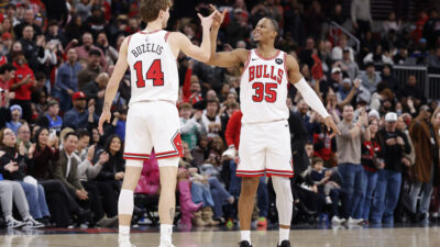 Jan 2, 2026; Chicago, Illinois, USA; Chicago Bulls forward Matas Buzelis (14) celebrates with forward Isaac Okoro (35) after defeating the Orlando Magic in a NBA game at United Center.