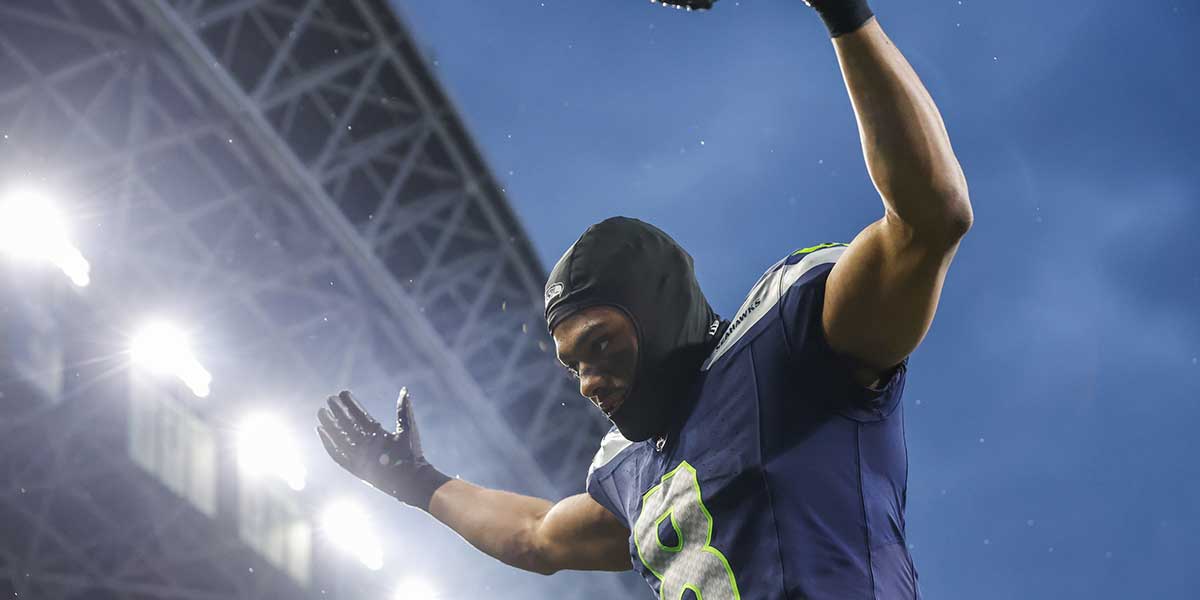 Nov 24, 2024; Seattle, Washington, USA; Seattle Seahawks cornerback Coby Bryant (8) celebrates as he walks to the locker room following a victory against the Arizona Cardinals at Lumen Field.
