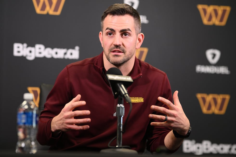 Washington Commanders offensive coordinator David Blough speaks to the media during an NFL...