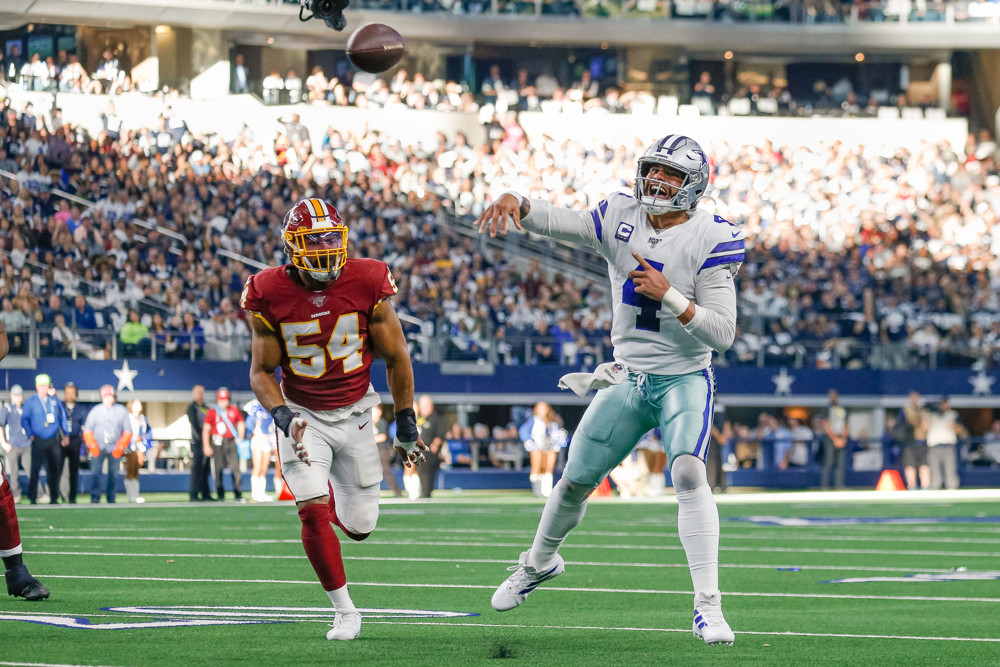 ARLINGTON, TX - DECEMBER 29: Dallas Cowboys Quarterback Dak Prescott (4) rolls out and throws a touchdown pass during the NFC East game between the Dallas Cowboys and Washington on December 29, 2019 at AT&T Stadium in Arlington, TX. (Photo by Andrew Dieb/Icon Sportswire)