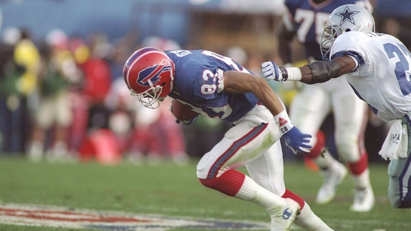 31 Jan 1993: Wide receiver Andre Reed of the Buffalo Bills (right) runs the ball during the Super Bowl XXVII game against the Dallas Cowboys at the Rose Bowl in Pasadena, California. The Cowboys won the game 52-17