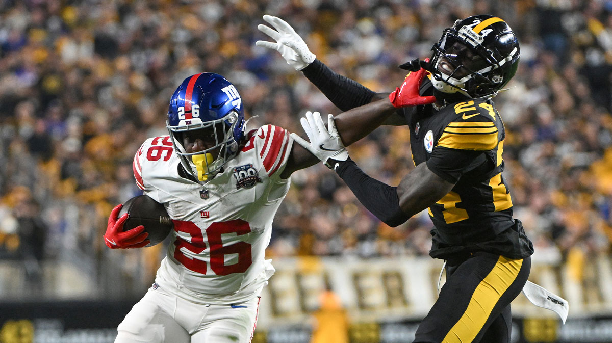 New York Giants running back Devin Singletary (26) stiff arms Pittsburgh Steelers cornerback Joey Porter Jr. (24) during the second quarter at Acrisure Stadium.