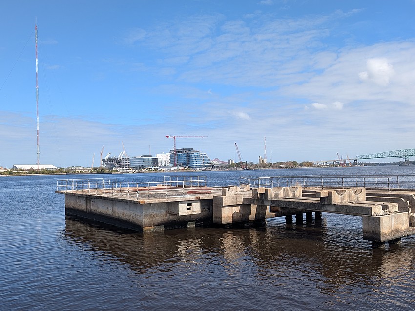 The One Tower Court office building and Four Seasons Hotel and Private Residence are shown Feb. 17 from the Southbank Riverbank near the RiversEdge development. The One Tower Court office building and Four Seasons Hotel and Private Residence are shown Feb. 17 from the Southbank Riverbank near the RiversEdge development.