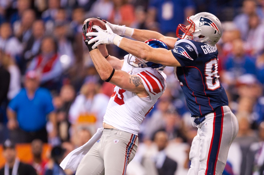 Chase Blackburn #93 of the New York Giants intercepts a pass from New England Patriots in the fourth quarter during Super Bowl XLVI at Lucas Oil Stadium on February 5, 2012 in Indianapolis, Indiana.