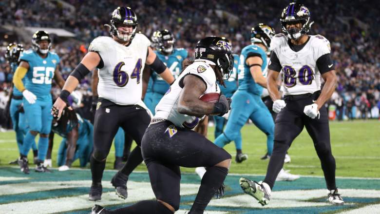 Tyler Linderbaum (64) and Isaiah Likely (80)