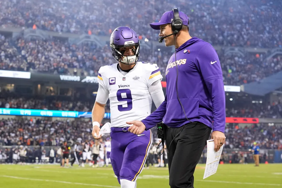 Head coach Kevin O’Connell of the Minnesota Vikings and J.J. McCarthy #9 speak on the sideline prior to the game against the Chicago Bears at Soldier Field
