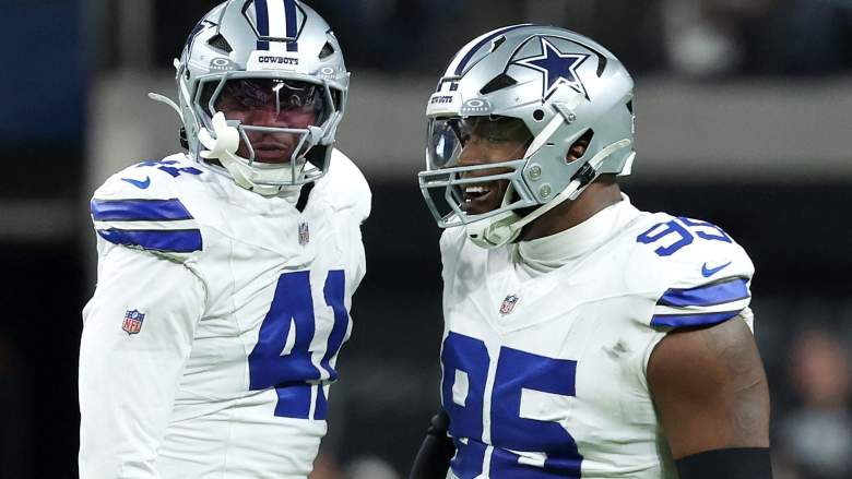 Donovan Ezeiruaku #41 and Kenny Clark #95 of the Dallas Cowboys
