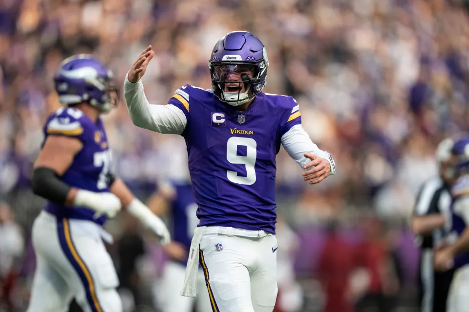 J.J. McCarthy #9 of the Minnesota Vikings celebrates after a touchdown by pumping his arms