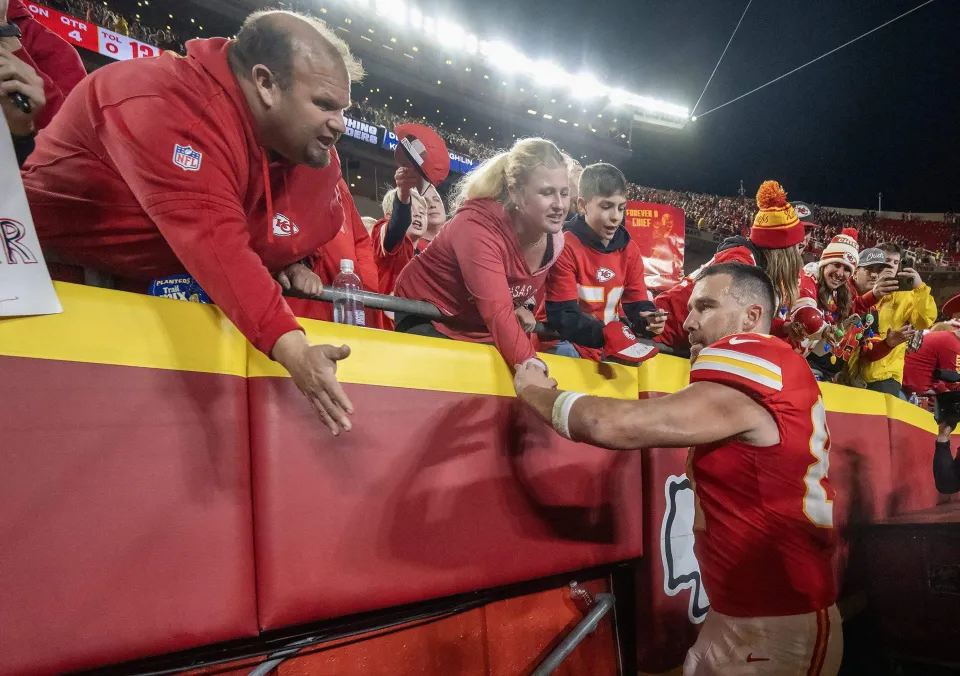Chiefs tight end Travis Kelce slaps hands with fans as he heads off the field after Kansas City's loss to the Denver Broncos at GEHA Field at Arrowhead Stadium on Thursday, Dec. 25, 2025, in Kansas City. (Tammy Ljungblad/Kansas City Star/Tribune News Service via Getty Images)