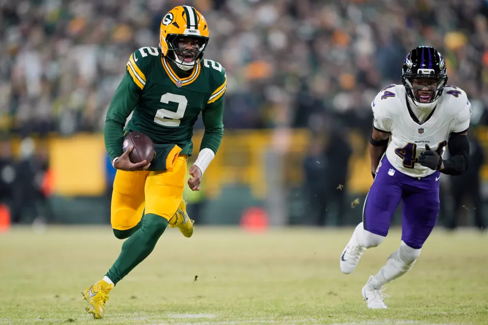 Malik Willis is running past Marlon Humphrey with the ball