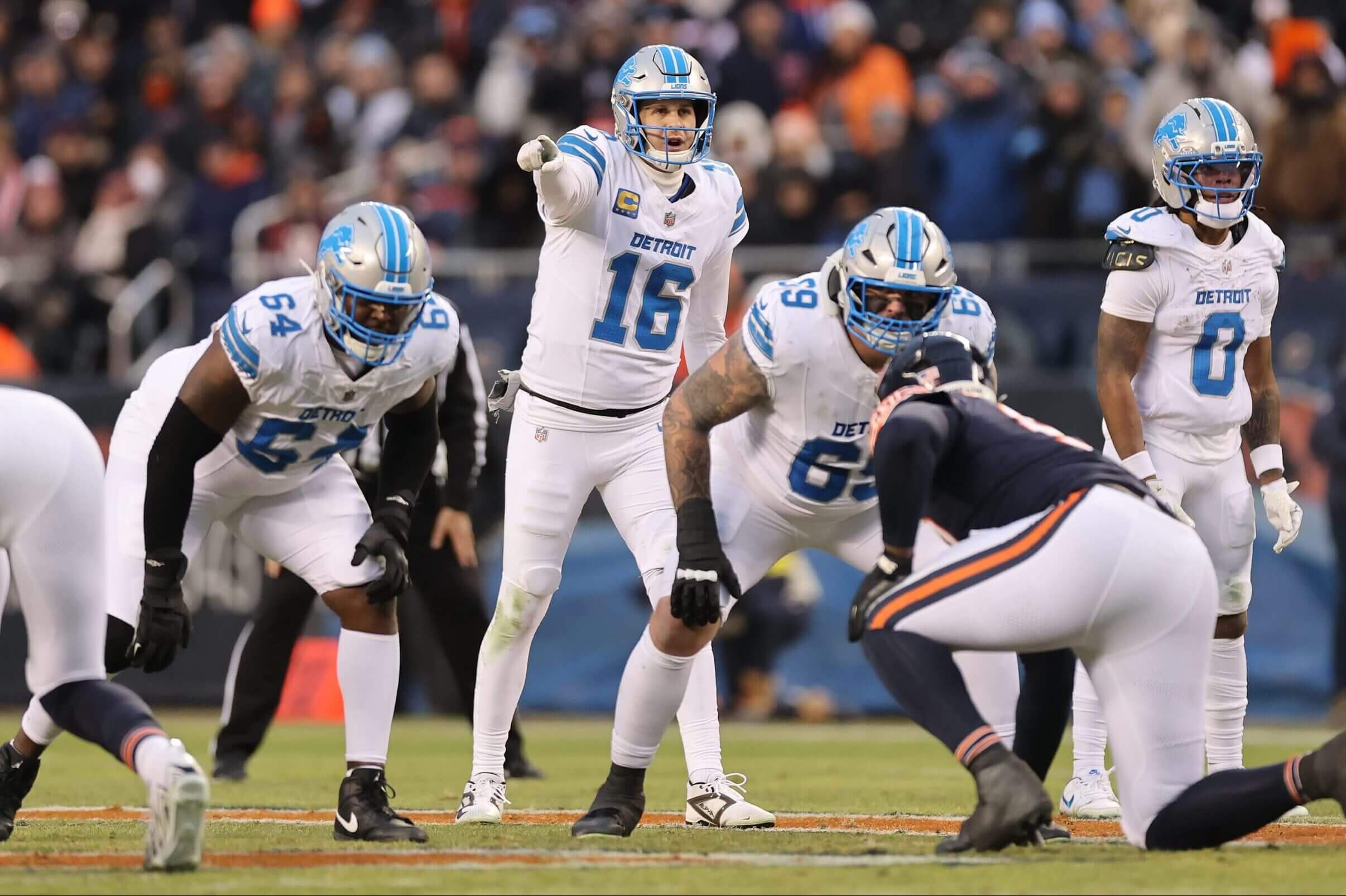 Jared Goff #16 of the Detroit Lions directs the offense against the Chicago Bears at Soldier Field on January 04, 2026 in Chicago.