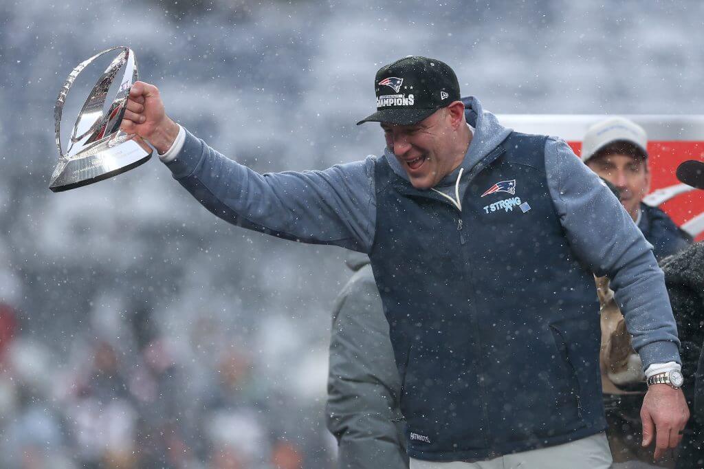 Patriots coach Mike Vrabel celebrates with the Lamar Hunt Trophy after New England beat the Denver Broncos in the AFC Championship Game.