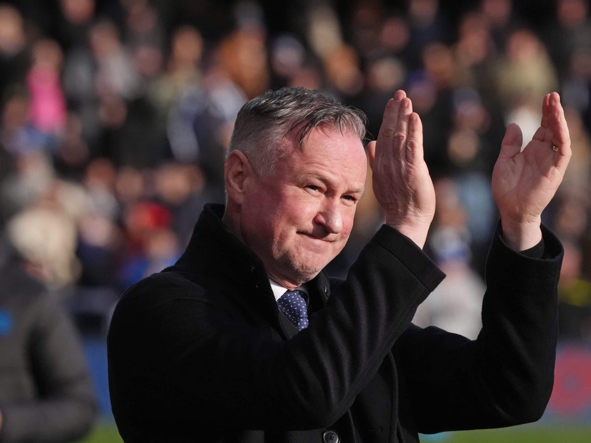 Michael O’Neill is managing two football teams in very different positions. Can it work?