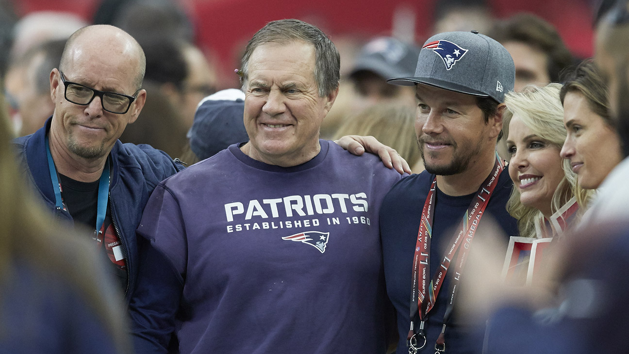 Super Bowl LI: Closeup of New England Patriots head coach Bill Belichick posing for photo on field with celebrity with actor Mark Wahlberg before game vs Atlanta Falcons at NRG Stadium. Houston, TX 2/5/2017