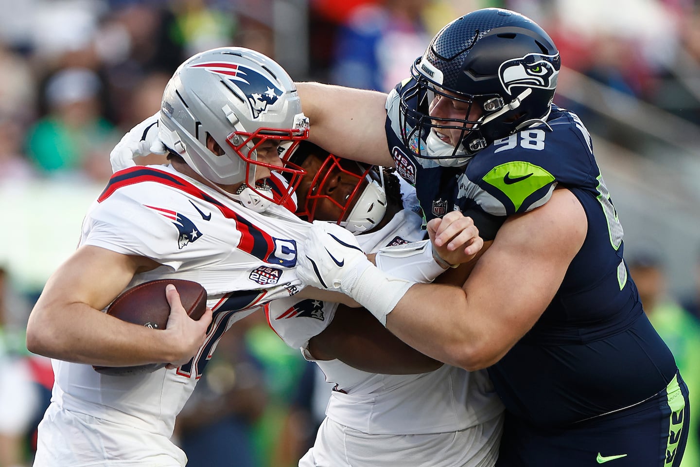 Seattle rookie defensive lineman Rylie Mills overpowered Patriots guard Jared Wilson to grab a hold of quarterback Drake Maye for a 10-yard sack in Super Bowl LX. 