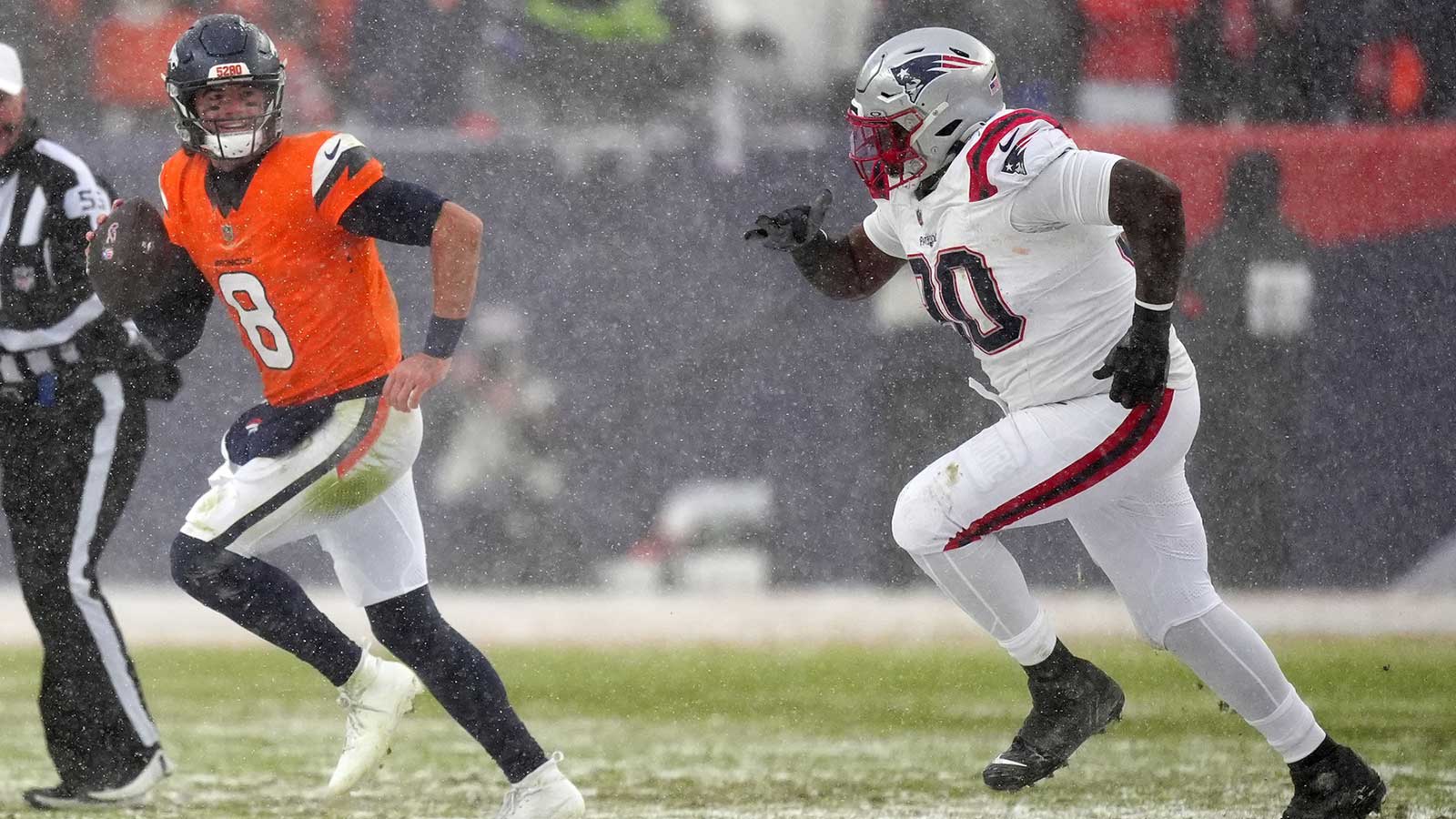 Denver Broncos quarterback Jarrett Stidham (8) drops back to pass against the New England Patriots during the second half in the 2026 AFC Championship Game at Empower Field at Mile High. 