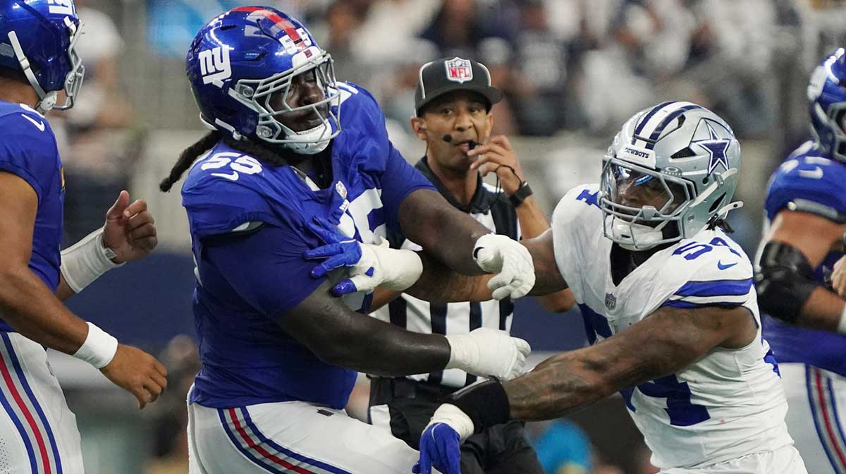 New York Giants offensive tackle James Hudson III (55) is called for a unnecessary roughness after a play against Dallas Cowboys defensive end Sam Williams (54) during the first quarter at AT&T Stadium.