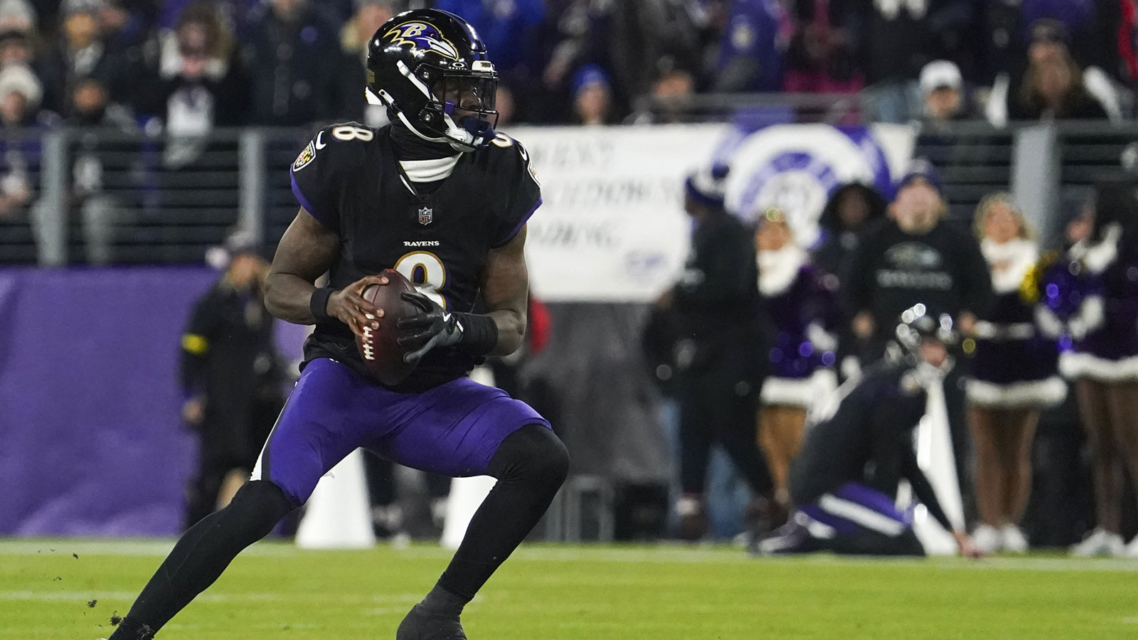 Baltimore Ravens quarterback Lamar Jackson (8) looks to pass against the New England Patriots during the first quarter of the game at M&T Bank Stadium.