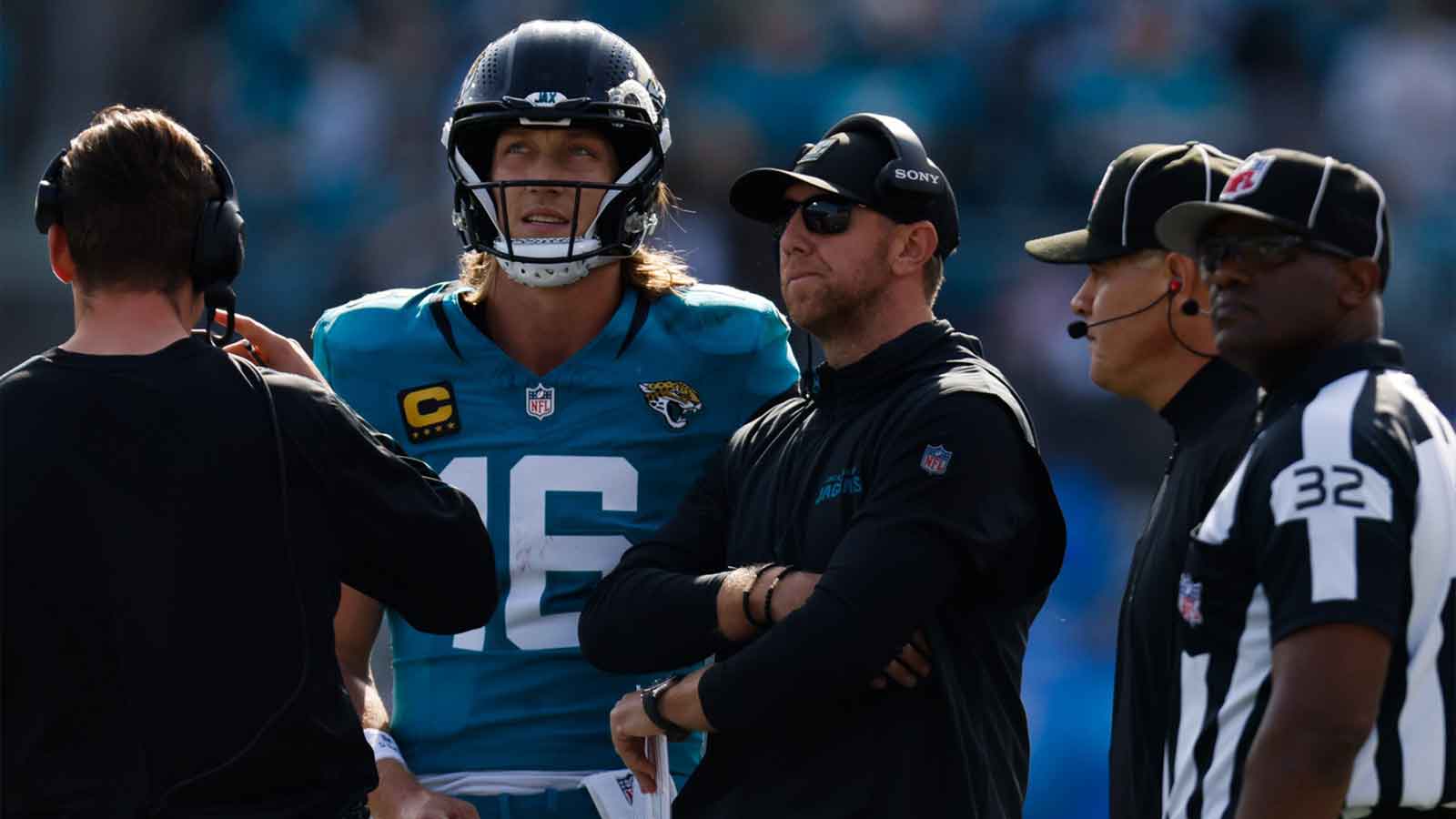 Jacksonville Jaguars quarterback Trevor Lawrence (16) and Jacksonville Jaguars head coach Liam Coen wait to see the result of a challenge during the second quarter in an NFL football AFC Wild Card playoff matchup, Sunday, Jan. 11, 2026, in Jacksonville, Fla. Bills lead 10-7 at the half over the Jaguars.