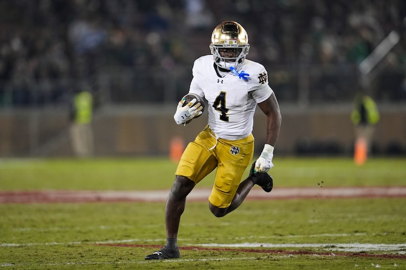 Notre Dame running back Jeremiyah Love (4) runs the ball during the second half of an NCAA...