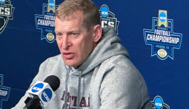 man speaking at microphone