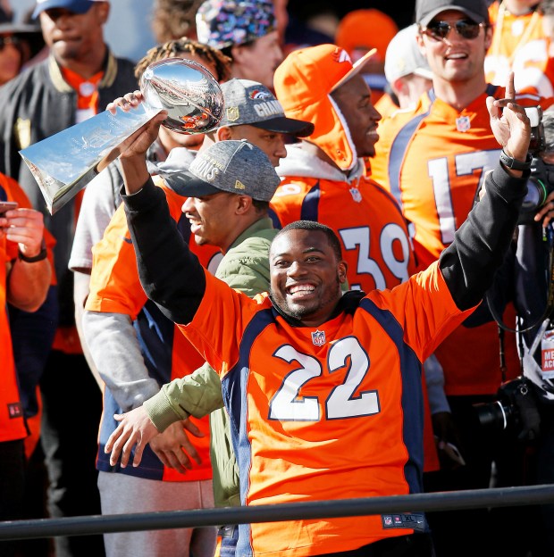 Denver Broncos running back and Bethel High grad C.J. Anderson holds the Lombardi Trophy at a rally following a parade through downtown Tuesday in Denver. Fans crowded into Denver's downtown to salute the Broncos for the team's victory over the Carolina Panthers in Super Bowl 50. Anderson will be inducted into the Vallejo Sports Hall of Fame on March 5. - David Zalubowski ASSOCIATED PRESS