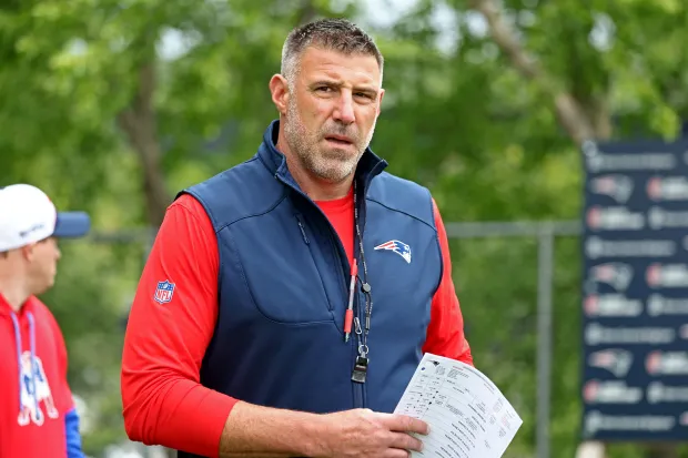 New England Patriots head coach Mike Vrabel enters the field as the Patriots hold OTA practice at Gillette on May 20. (Staff Photo By Stuart Cahill/Boston Herald)