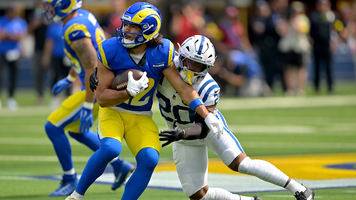 Los Angeles Rams wide receiver Puka Nacua (12) is stopped by Indianapolis Colts safety Nick Cross (20) after a complete pass in the first half at SoFi Stadium.