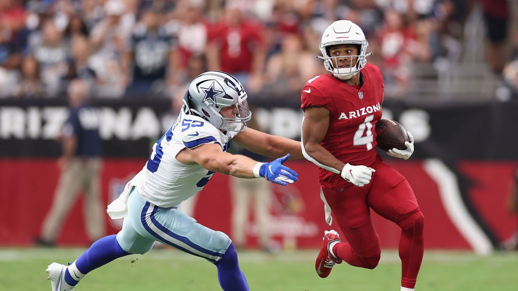 GLENDALE, ARIZONA - SEPTEMBER 24: Wide receiver Rondale Moore #4 of the Arizona Cardinals runs with the football ahead of linebacker Leighton Vander Esch #55 of the Dallas Cowboys during the NFL game at State Farm Stadium on September 24, 2023 in Glendale, Arizona.  The Cardinals defeated the Cowboys 28-16.  (Photo by Christian Petersen/Getty Images)