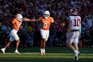 Texas linebacker Anthony Hill Jr. (0) celebrates after forcing a turnover on downs as...