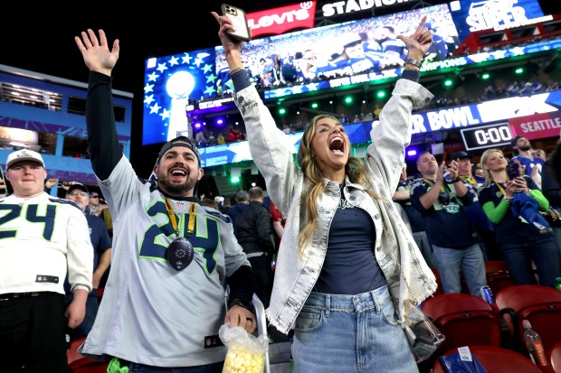 Seattle Seahawks fans celebrate their team's 29-13 win after defeating the New England Patriots during Super Bowl 60 at Levi's Stadium in Santa Clara, Calif., on Sunday, Feb. 8, 2026. (Ray Chavez/Bay Area News Group)