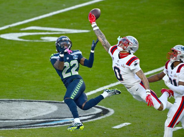 Seattle Seahawks' Rashid Shaheed (22) is unable to catch a pass while being covered by New England Patriots' Christian Gonzalez (0) in the second quarter of Super Bowl 60 at Levi's Stadium in Santa Clara, Calif., on Sunday, Feb. 8, 2026. (Jose Carlos Fajardo/Bay Area News Group)