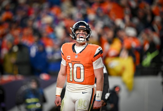 Bo Nix (10) of the Denver Broncos roars after throwing a touchdown pass to Marvin Mims Jr. (19) during the fourth quarter of the Broncos' 33-30 overtime win over the Buffalo Bills at Empower Field at Mile High in Denver, Colorado on Saturday, January 17, 2026. (Photo by AAron Ontiveroz/The Denver Post)