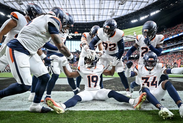 Marvin Mims Jr. (19) of the Denver Broncos celebrates taking a punt return to the house with fellow special team members against the Las Vegas Raiders during the second quarter at Allegiant Stadium in Las Vegas, Nevada on Sunday, Dec. 7, 2025. (Photo by AAron Ontiveroz/The Denver Post)