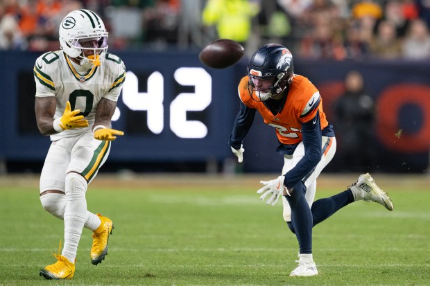 Wide receiver Matthew Golden (0) of the Green Bay Packers reels in a catch while being defended by cornerback Riley Moss (21) of the Denver Broncos on Sunday, Dec. 14, 2025, at Empower Field at Mile High Stadium in Denver. (Photo by Timothy Hurst/The Denver Post)
