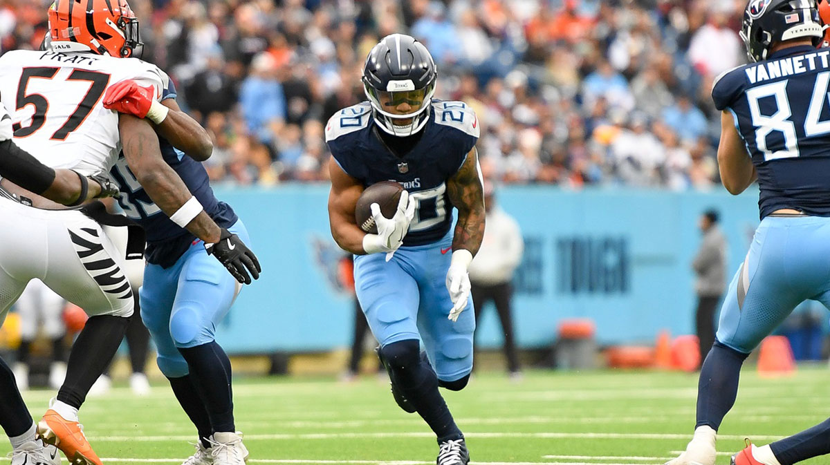 Tennessee Titans running back Tony Pollard (20) runs the ball against the Cincinnati Bengals during the first half at Nissan Stadium.