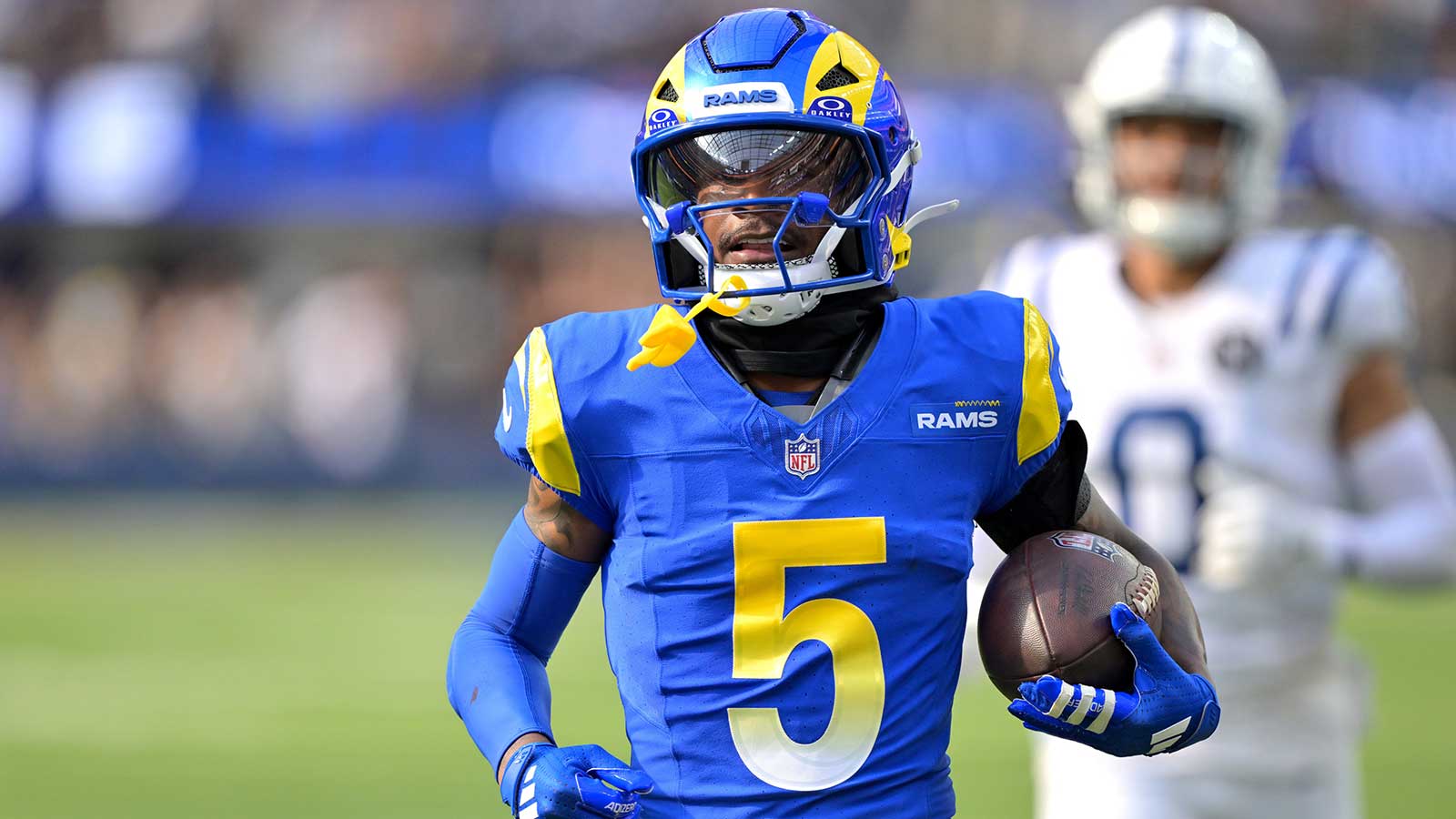 Los Angeles Rams wide receiver Tutu Atwell (5) runs for a touchdown on an 88 yard pass play in the fourth quarter against the Indianapolis Colts at SoFi Stadium