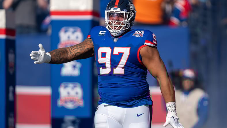 Dexter Lawrence runs out of the tunnel before a Giants game against the Commanders. Dexter Lawrence Vikings