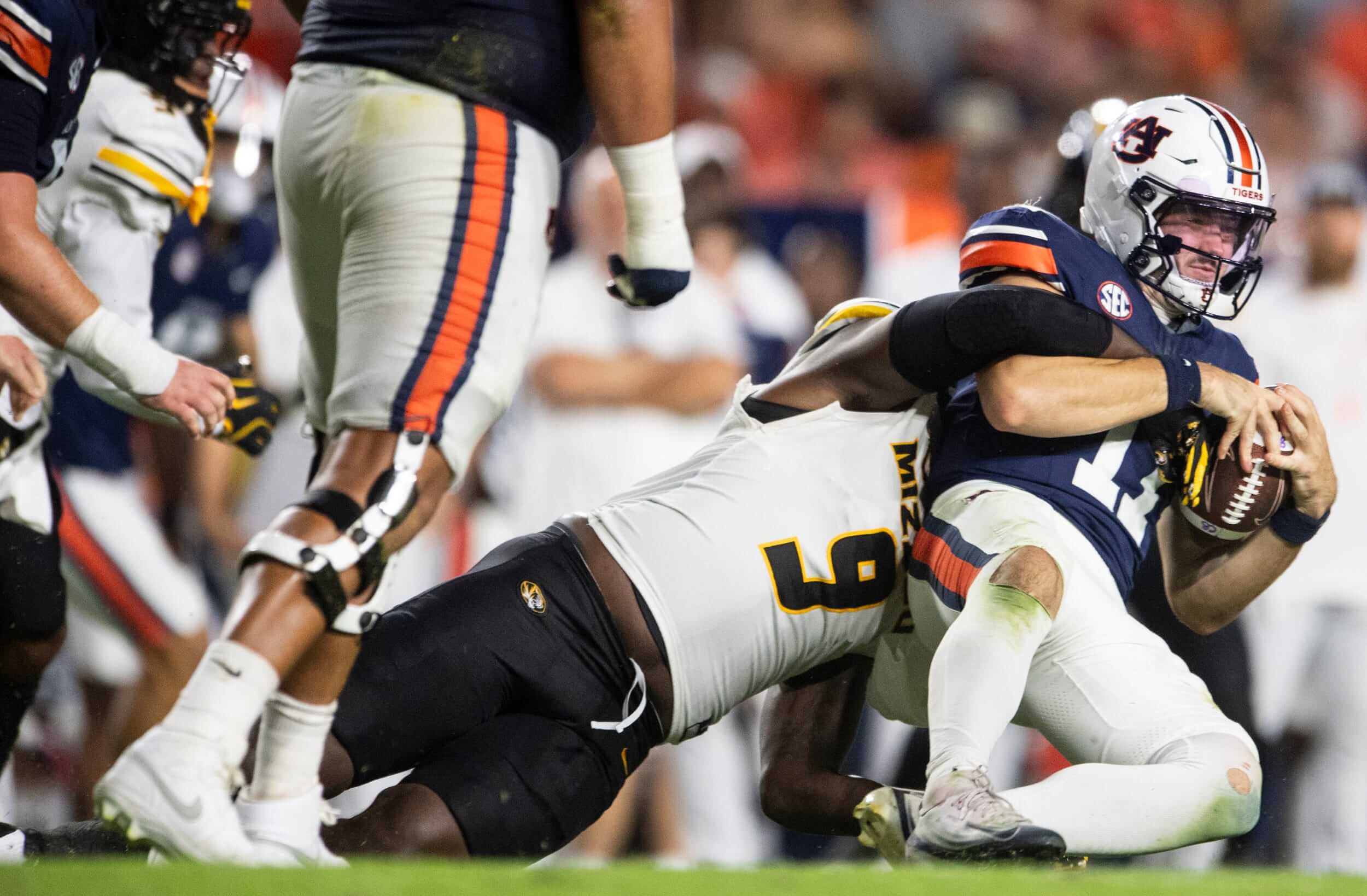 Auburn Tigers quarterback Jackson Arnold (11) is sacked by Missouri Tigers defensive end Zion Young (9) at Jordan-Hare Stadium in Auburn, Ala., on Saturday, Oct. 18, 2025.