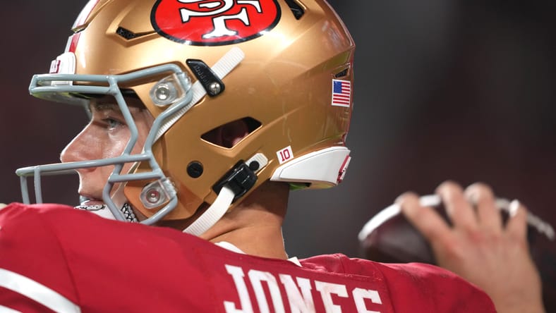 Mac Jones warms up on the field at Levi's Stadium before a 49ers game.