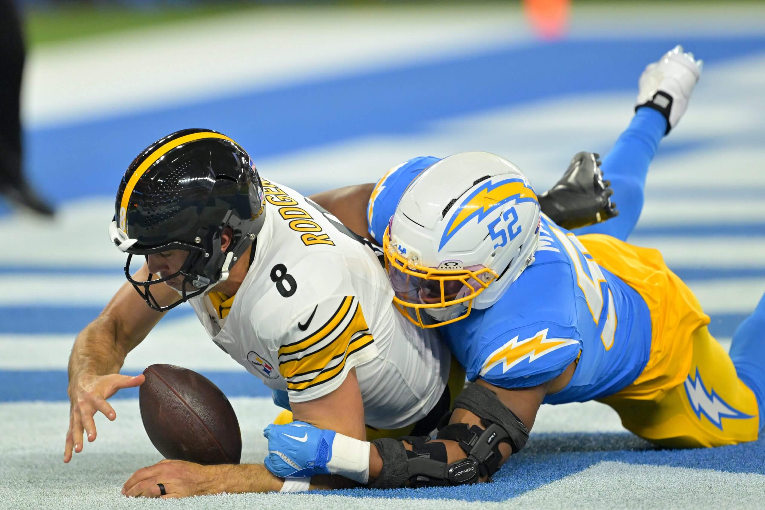 Los Angeles Chargers linebacker Khalil Mack (52) sacks Pittsburgh Steelers quarterback Aaron Rodgers (8) for a safety during the first quarter of the game at SoFi Stadium.