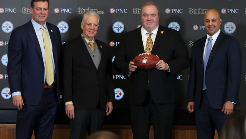Mike McCarthy introduced as Steelers head coach with team executives beside him.
