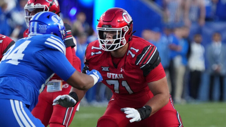 Utah offensive lineman Caleb Lomu (71) prepares to block BYU defensive end Anisi Purcell (94) during the first half of an NCAA college football game, Saturday, Oct. 18, 2025, in Provo, Utah.